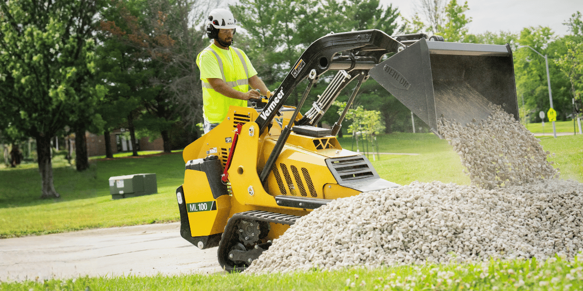 Vermeer ML100 Mini Loader with bucket dumping gravel