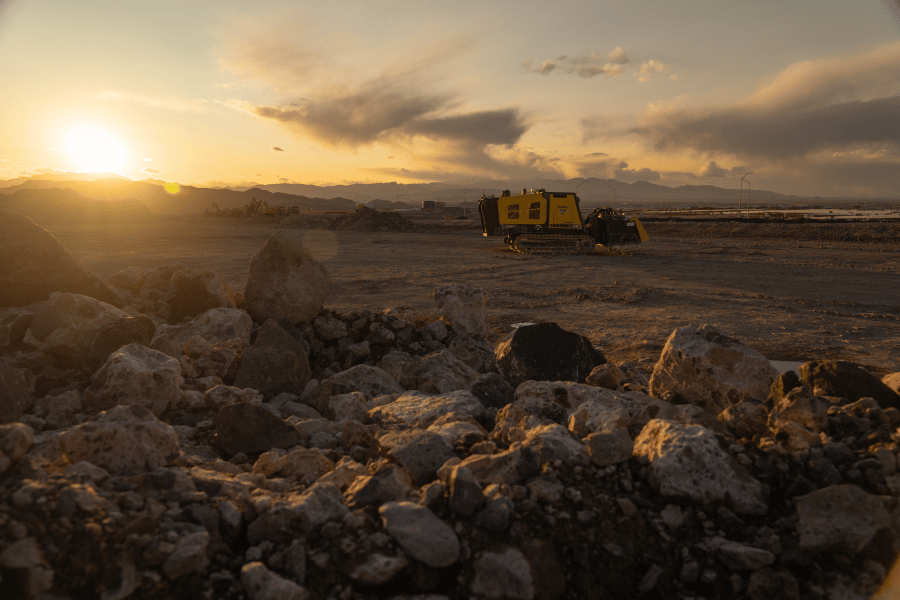 Vermeer SM55 Surface Miner in distance behind rock pile